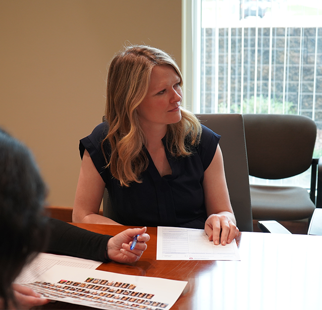 Faculty member discussing a topic.