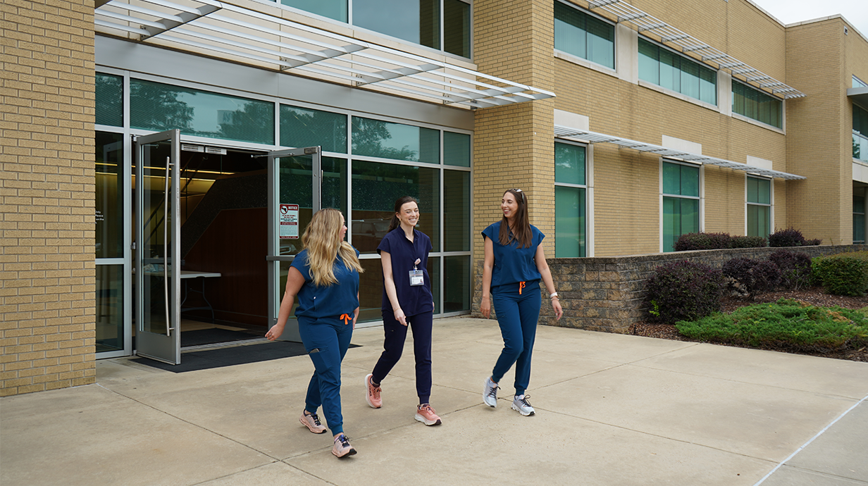 Student walking out of our Jackson campus building