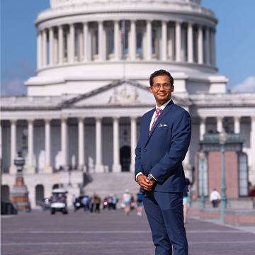 Dr. Sujith Ramachandran posing for a photo as a Robert Wood Johnson Foundation Health Policy Fellows at the National Academy of Medicine.
