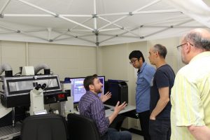 Dr. Paris, Dr. Cao, Dr. Del Arco and Dr. Roman working with the imaging core instrumentation 