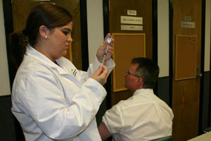 Kayla Hawkins (left) administered flu shots at last year's Operation Immunization event.