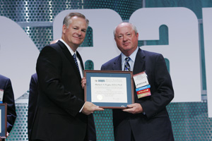 Michael A. Repka (right) accepts a certificate recognizing his honor from AAPS President David Mitchell