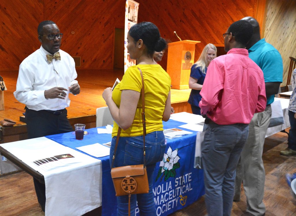 Exhibitors meet with students and discuss the pharmacy profession