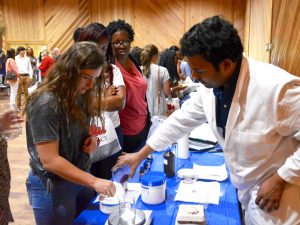 Pharmacy showcase attendee compounding at event.