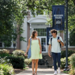 Two students walk together on the Mississippi College campus
