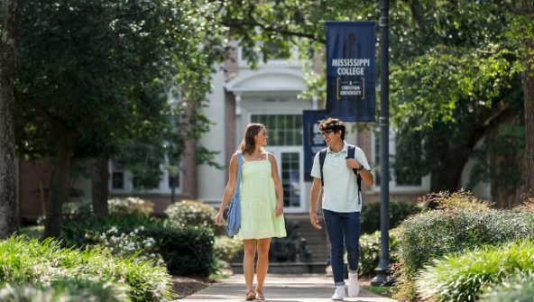 Two students walk together on the Mississippi College campus