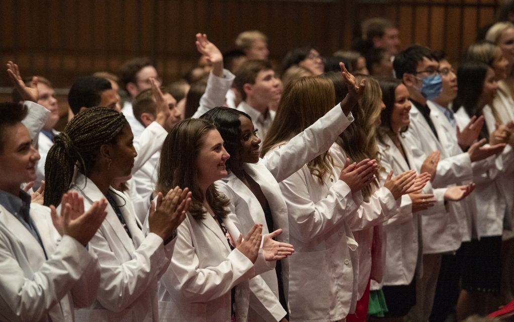 Pharmacy students clapping.