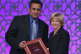 American Association of Pharmaceutical Scientists president Marilyn E. Morris presents Soumyajit Majumdar with the Lipid-Based Drug Delivery Outstanding Research Award.